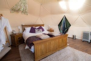 Luxury bed in glamping dome